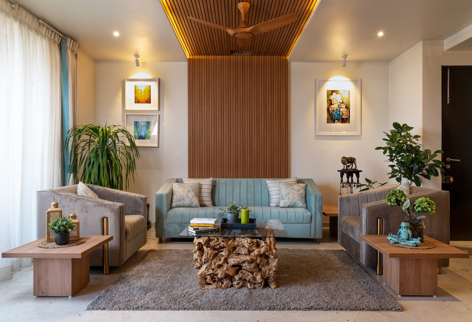 A warm interior with timber ceiling and blue sofa